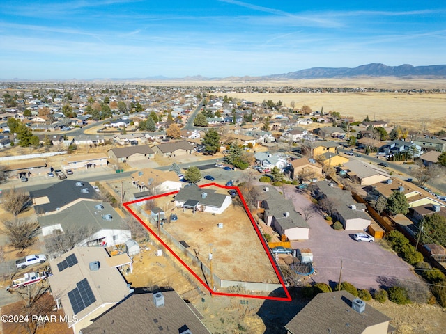 birds eye view of property featuring a mountain view