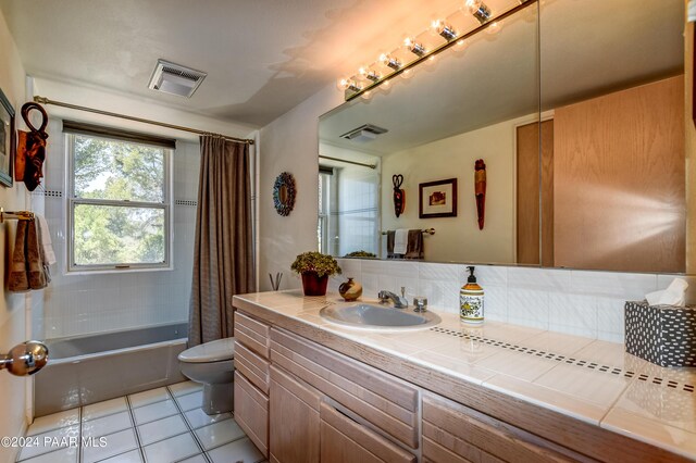 1301 S Manzanita Hill Rd, Prescott, AZ 86303 - full bathroom with vanity, tile patterned flooring, visible vents, toilet, and shower / bath combo with shower curtain