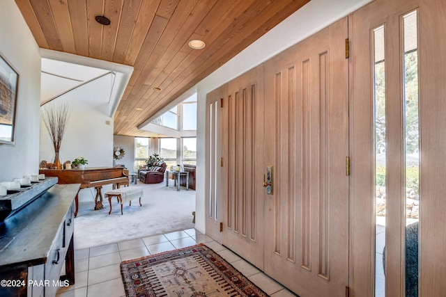 1301 S Manzanita Hill Rd, Prescott, AZ 86303 - entrance foyer with light tile patterned floors, vaulted ceiling, wood ceiling, and light colored carpet