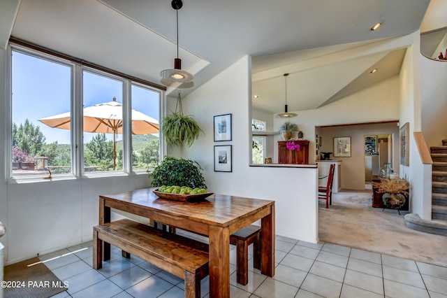 1301 S Manzanita Hill Rd, Prescott, AZ 86303 - dining area featuring light carpet, stairway, vaulted ceiling, and light tile patterned floors