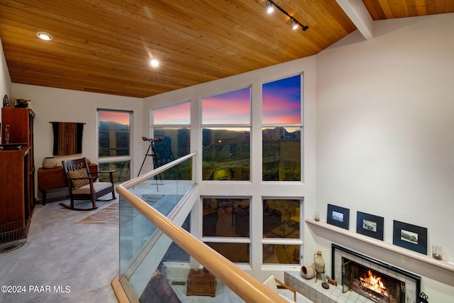 1301 S Manzanita Hill Rd, Prescott, AZ 86303 - interior space with track lighting, lofted ceiling with beams, carpet floors, a brick fireplace, and wooden ceiling