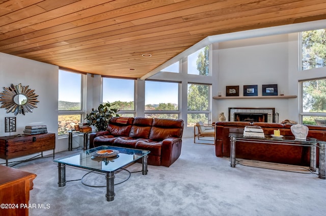 1301 S Manzanita Hill Rd, Prescott, AZ 86303 - carpeted living room featuring wood ceiling, a fireplace, and a towering ceiling