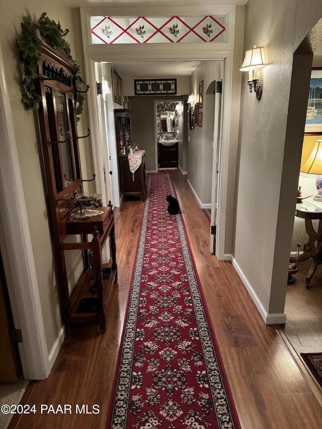 corridor featuring dark wood-type flooring