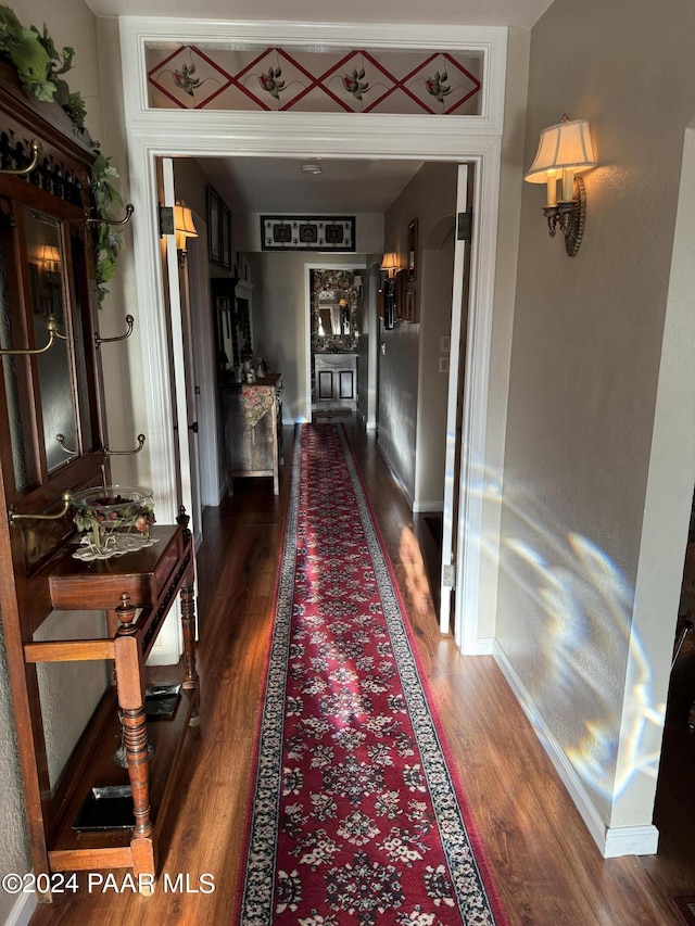 hall featuring dark wood-type flooring