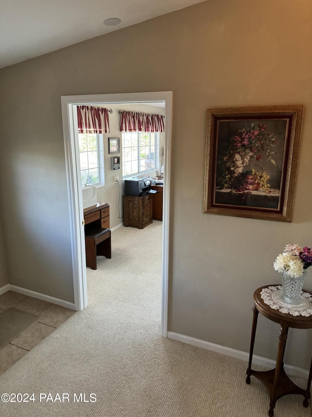 hallway with light carpet