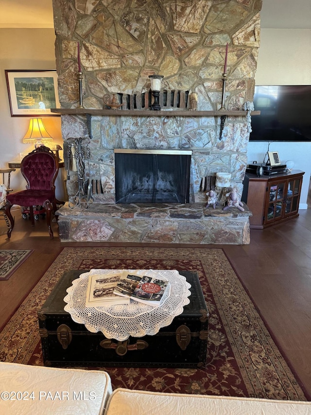 living room featuring a fireplace and hardwood / wood-style floors