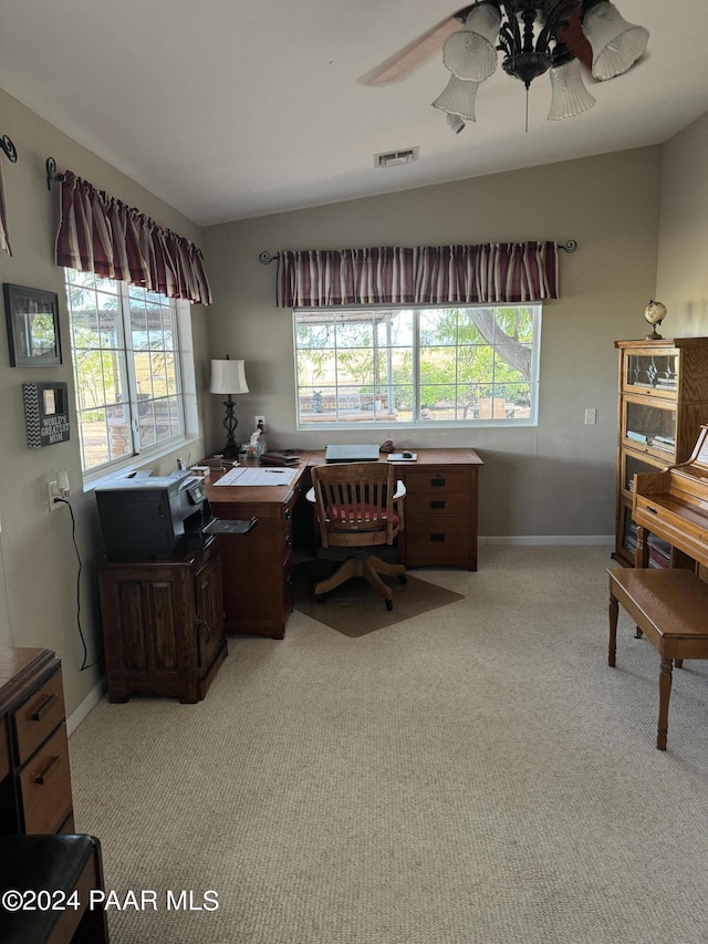 office featuring ceiling fan, light colored carpet, and vaulted ceiling