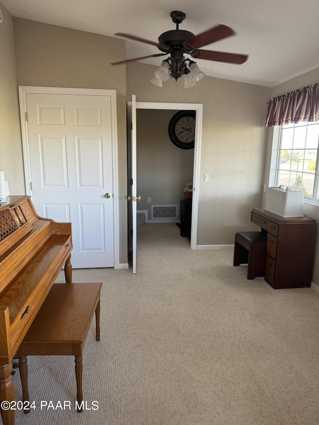 miscellaneous room featuring ceiling fan, light carpet, and vaulted ceiling