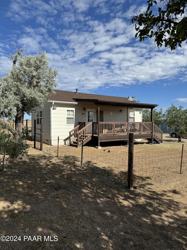 back of house featuring a deck