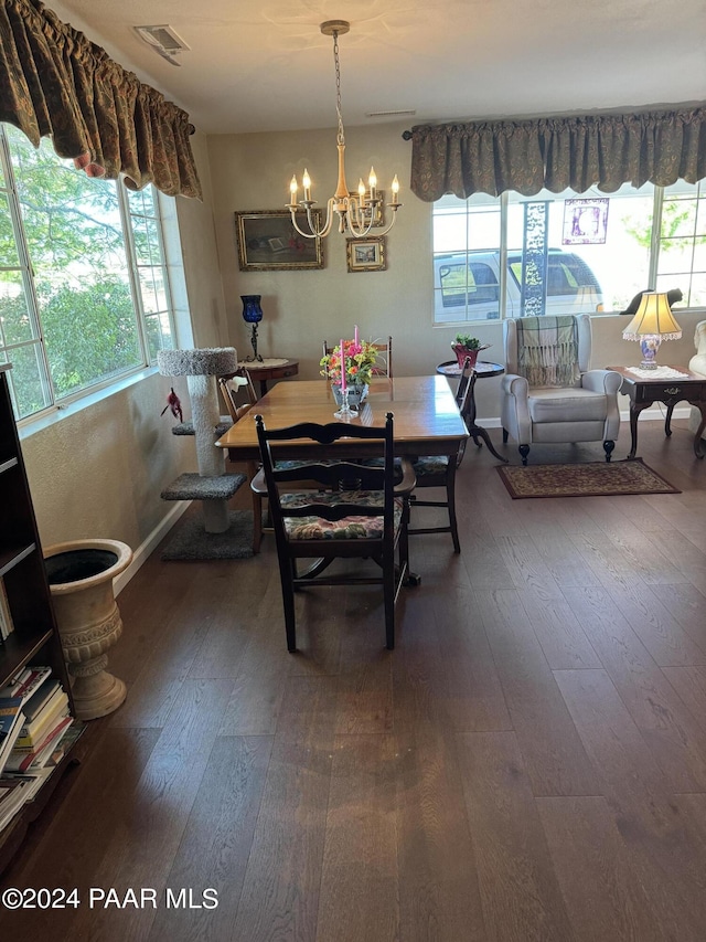 dining room featuring wood-type flooring and plenty of natural light