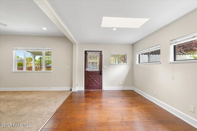 122 N Willow St, Prescott, AZ 86305 - foyer featuring a skylight, plenty of natural light, wood finished floors, baseboards, and recessed lighting