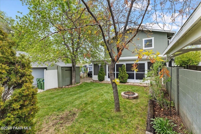 122 N Willow St, Prescott, AZ 86305 - view of yard with an outdoor fire pit, a storage unit, an outdoor structure, and a sunroom