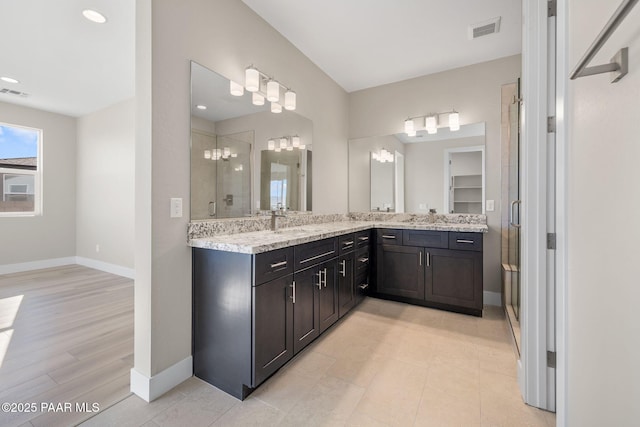 bathroom featuring vanity and walk in shower