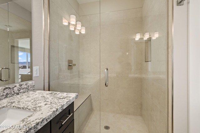 bathroom featuring vanity and walk in shower