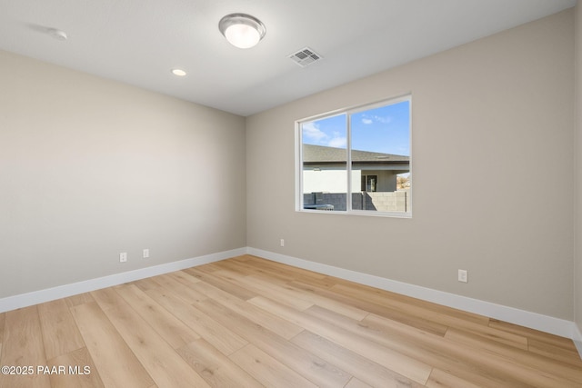 unfurnished room featuring light wood-type flooring