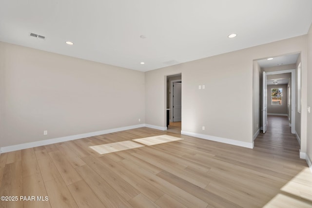 unfurnished room featuring light hardwood / wood-style flooring