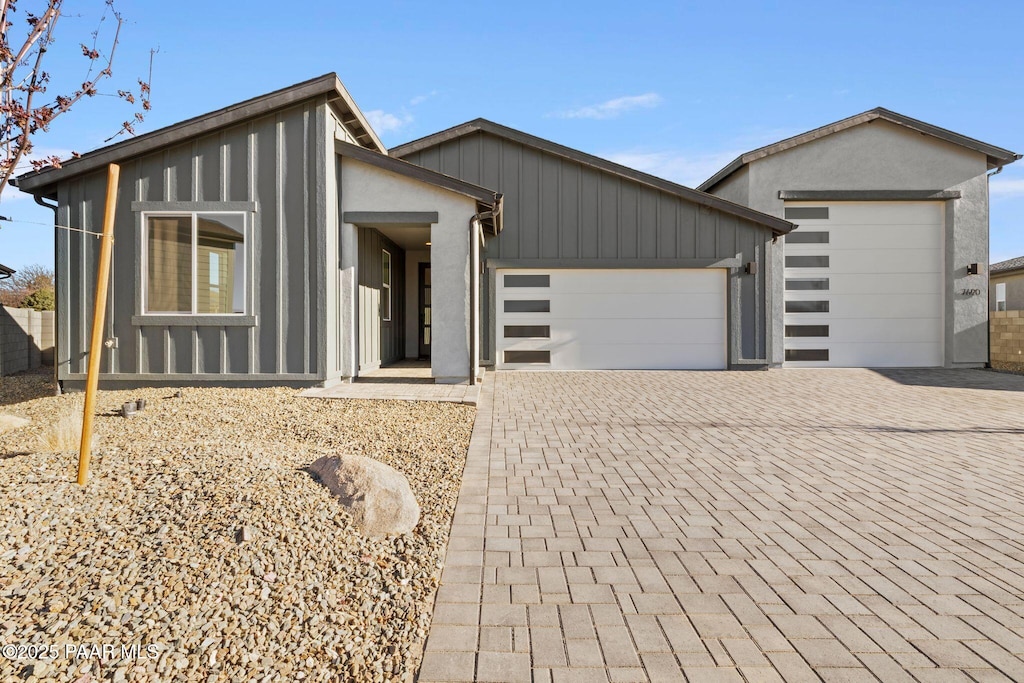 7690 E Louie Ln, Prescott Valley, AZ 86315 - modern home featuring an attached garage and decorative driveway