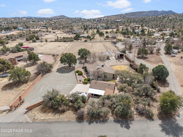 aerial view featuring view of desert and a mountain view