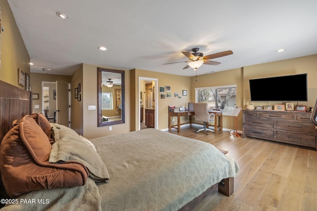 bedroom with recessed lighting, wood finished floors, and baseboards