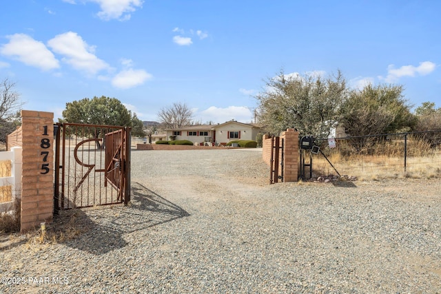 view of gate featuring fence