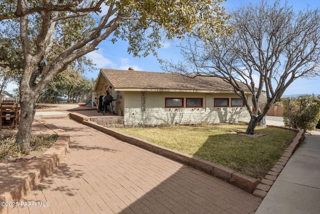 view of home's exterior with a lawn