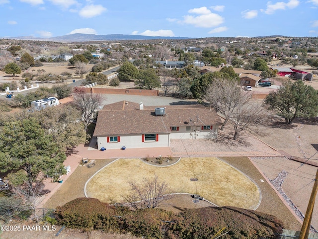 birds eye view of property with a mountain view