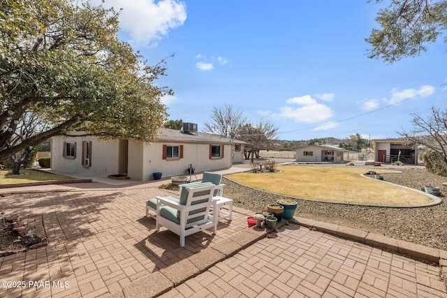 view of patio with central AC