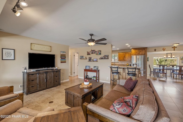 living area with ceiling fan, baseboards, light tile patterned flooring, and recessed lighting