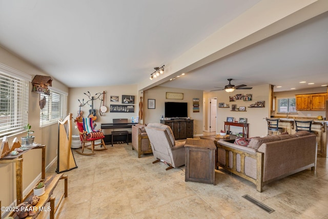 living area featuring recessed lighting, visible vents, and ceiling fan