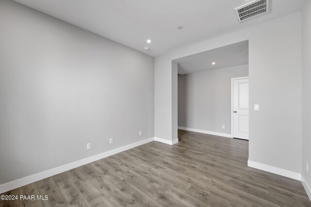 spare room with hardwood / wood-style flooring