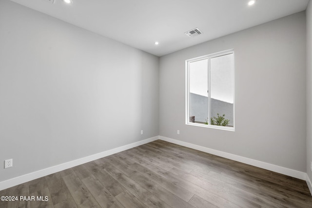 empty room featuring hardwood / wood-style flooring