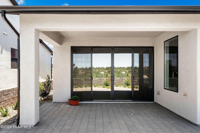 property entrance with a patio area