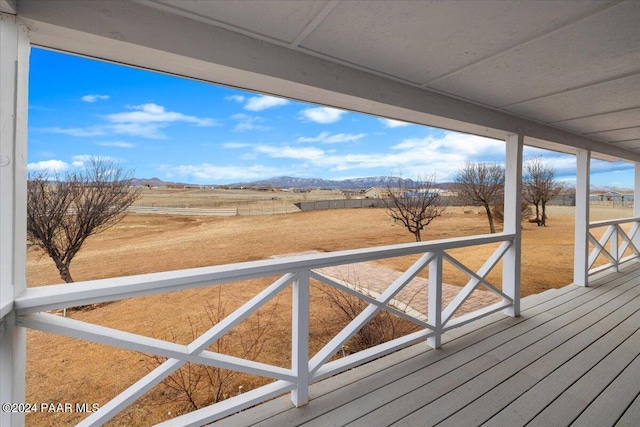 deck featuring a mountain view and a rural view