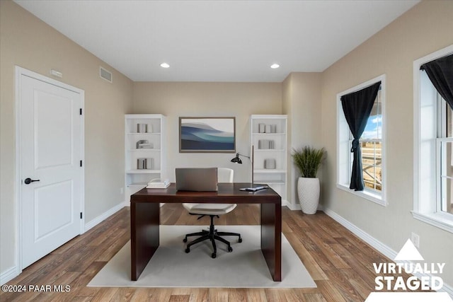 office with hardwood / wood-style flooring