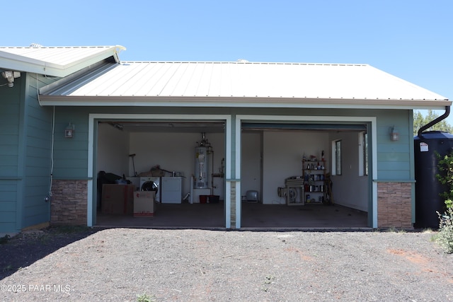 1155 W Half Moon Ct, Ash Fork, AZ 86320 - garage with secured water heater and washer and clothes dryer