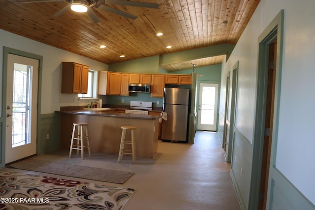 1155 W Half Moon Ct, Ash Fork, AZ 86320 - kitchen featuring appliances with stainless steel finishes, wood ceiling, a peninsula, plenty of natural light, and dark countertops
