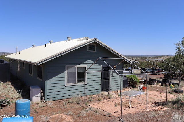 1155 W Half Moon Ct, Ash Fork, AZ 86320 - back of house with a patio and a mountain view