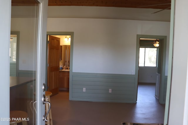 1155 W Half Moon Ct, Ash Fork, AZ 86320 - bedroom featuring finished concrete floors and ensuite bath
