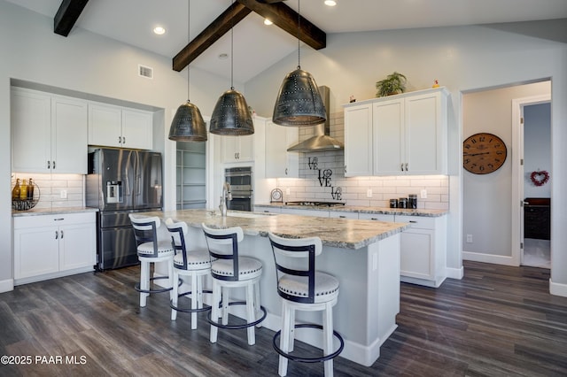 kitchen featuring stainless steel appliances, vaulted ceiling with beams, dark hardwood / wood-style flooring, pendant lighting, and white cabinets