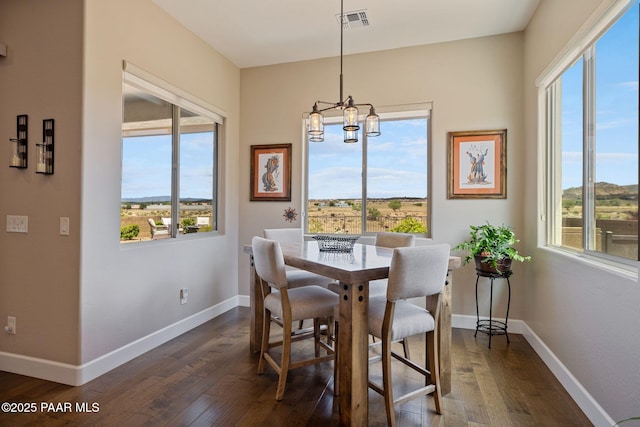 5313 Autumn Leaf Ln, Prescott, AZ 86301 - dining area with dark wood finished floors, healthy amount of natural light, and a chandelier