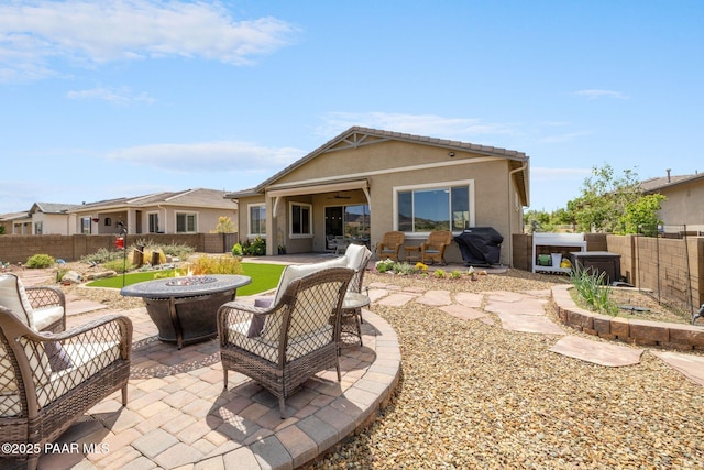 5313 Autumn Leaf Ln, Prescott, AZ 86301 - rear view of house with an outdoor fire pit, a fenced backyard, a patio, and ceiling fan