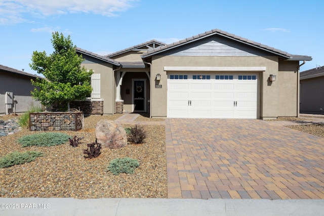 5313 Autumn Leaf Ln, Prescott, AZ 86301 - single story home with stucco siding, a garage, a tiled roof, decorative driveway, and stone siding