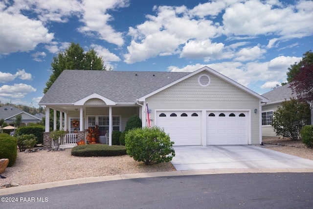 view of front of house featuring a porch and a garage