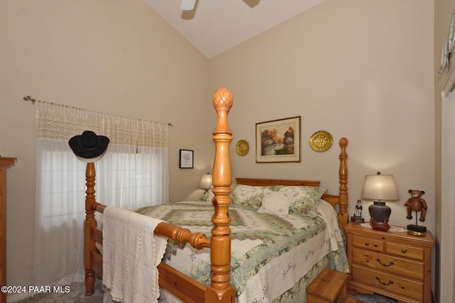 carpeted bedroom with ceiling fan and vaulted ceiling