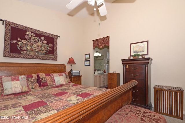 bedroom with ceiling fan, carpet floors, and ensuite bathroom