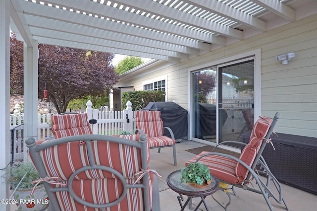 view of patio / terrace with area for grilling and a pergola