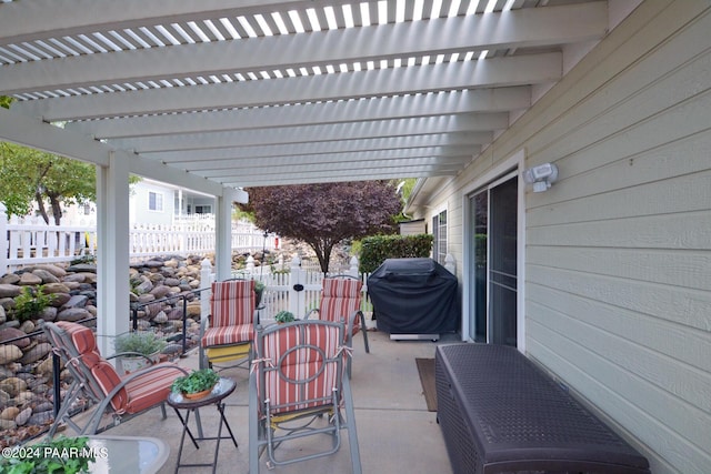 view of patio featuring a pergola and a grill