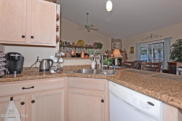 kitchen featuring ceiling fan, sink, white dishwasher, lofted ceiling, and light brown cabinetry