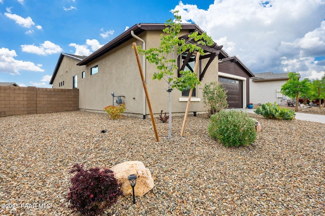 5253 Tranquil Bluff Way, Prescott, AZ 86301 - view of side of home with a garage and stucco siding