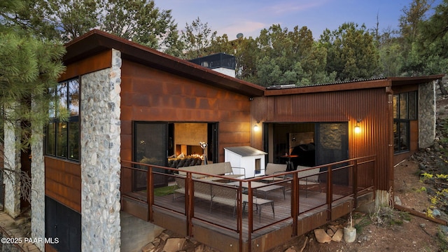 51 Rill Rd, Prescott, AZ 86305 - back of house at dusk featuring a deck and a chimney